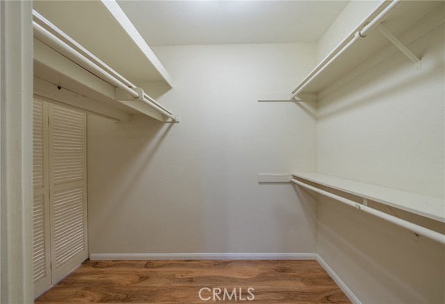 Master suite walk in closet has a lot of storage.