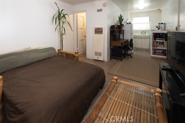 Studio with view toward kitchen and closets