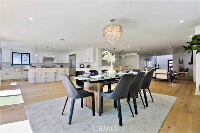 The Great Room with it's Spacious Dining Area, Gourmet Kitchen, Living Room and Bar, flow to create a Wonderful Open Environment for a Large Family to Relax as well as, Entertaining on a Grand Scale.