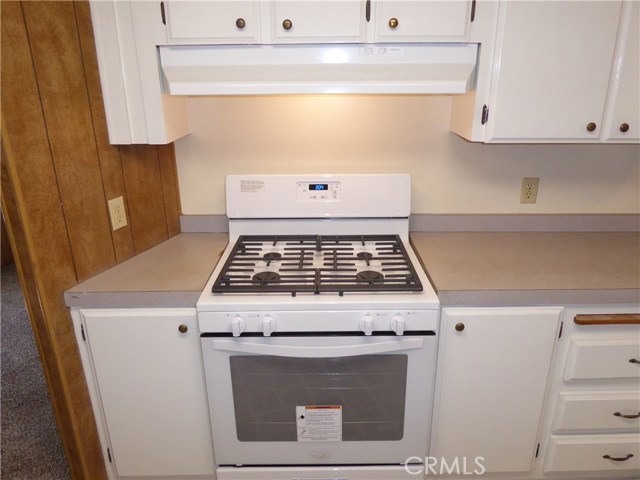 New Whirlpool stove and range hood.