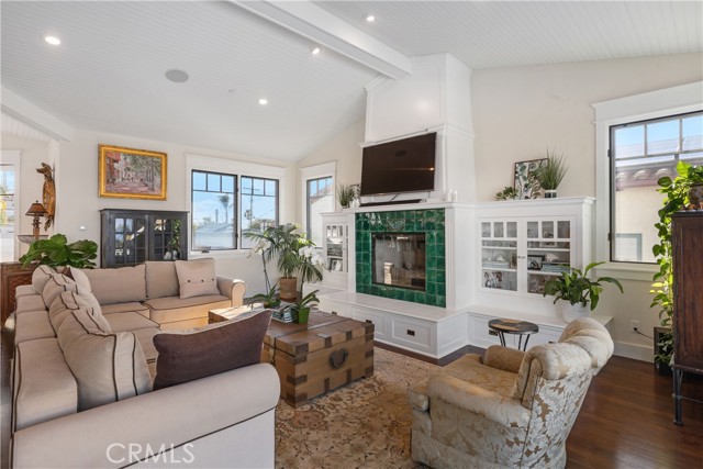 Warm wood floors provide appealing contrast to white walls and white wood ceiling