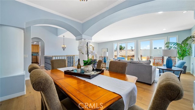 Dining room with living room in the background.  The kitchen in the background to the left.