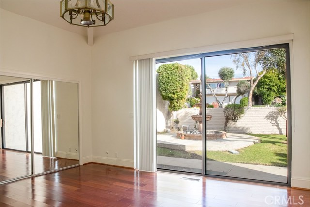 Mid level second Master Suite with doors to outside