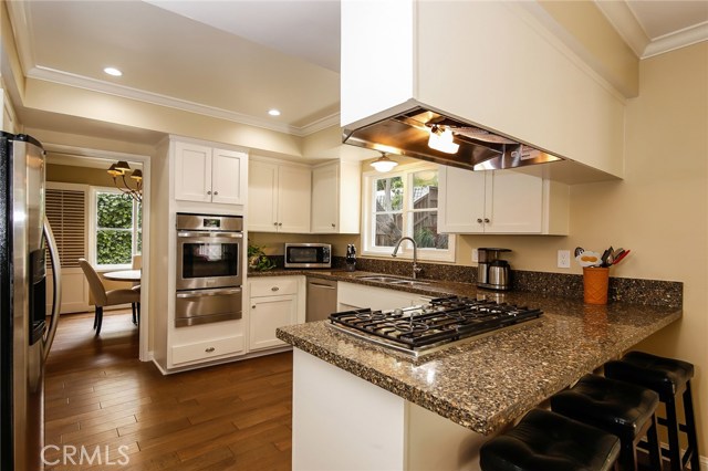 Enjoy cooking in this gourmet kitchen while simultaneously being able to keep an eye on kids or pets playing in the backyard: )