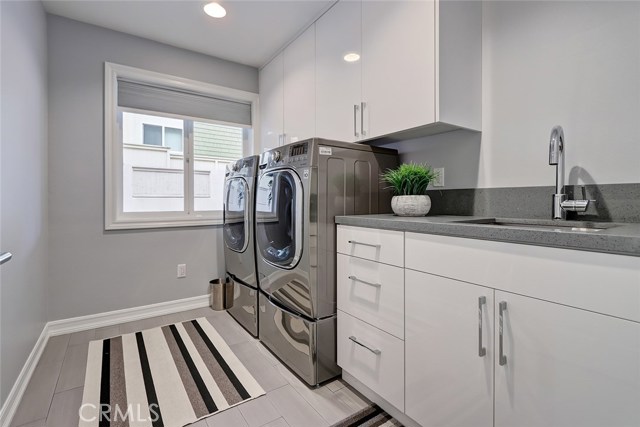 Oversized laundry room, with soaking sink and extra storage