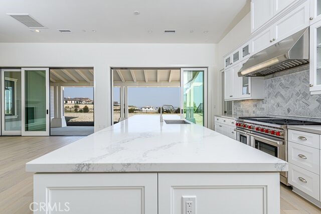 Kitchen  opens to covered patio, back yard and views of the private golf course, mountains and city lights.