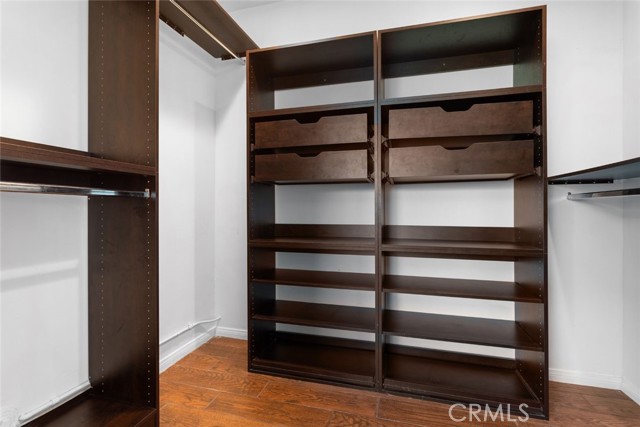 Master Suite -walk in closet with custom made drawers and cabinets