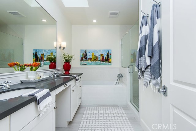 His and Her sinks, bathtub in addition to oversized shower.