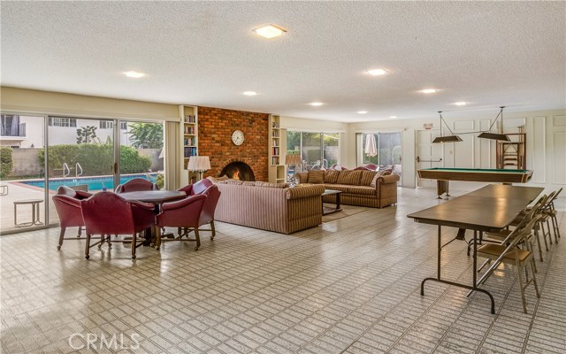 Club house with pool table and kitchen.