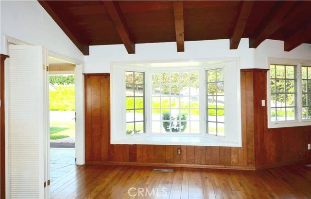 Located to the left of the front entry is a sweet bay window and the family/dining open plan space off of the kitchen. Original peg and groove floors.