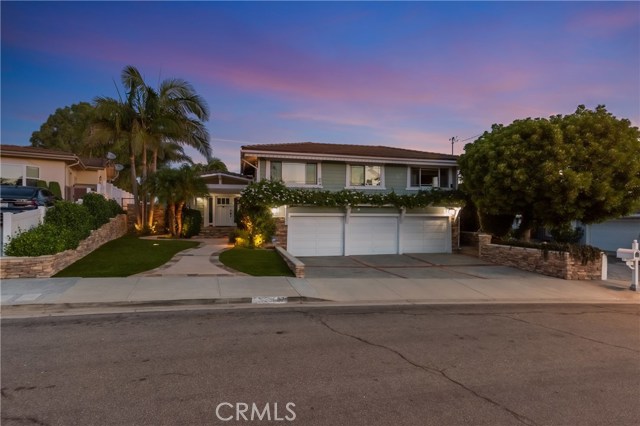 Nice curb appeal with lovely landscaping, and 3 car garage!  The upstairs is the 2 bedroom 2 bath suite that has an adorable kitchenette that can be accessed privately.  Perfect for out of town guests, in-laws, or teenagers! Both bedrooms are very large, one has attached full bathroom.