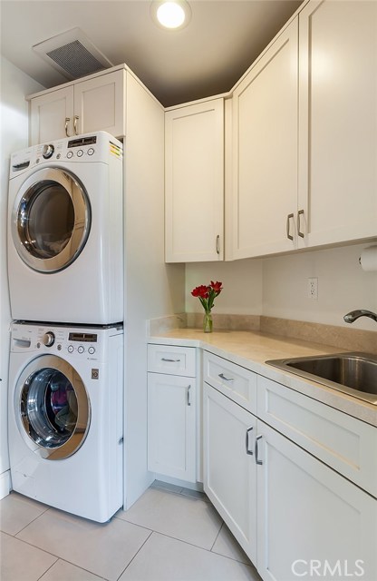 Laundry room with more storage to the left