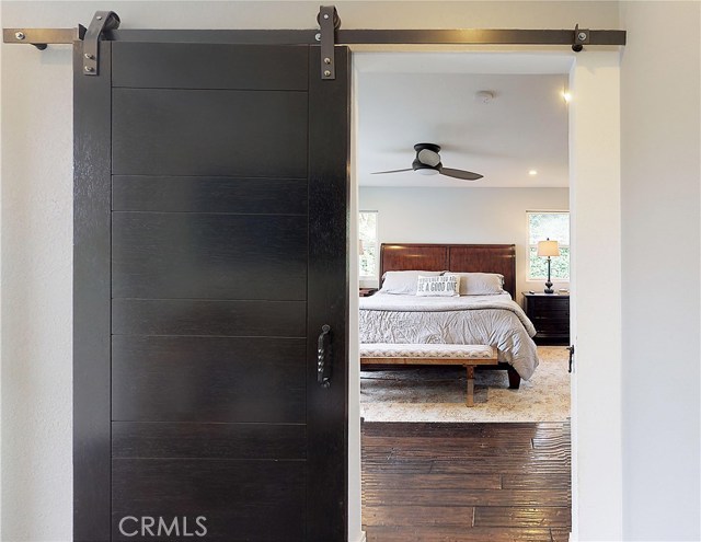Barn door leads to master bedroom. Barn door leads to master bedroom.