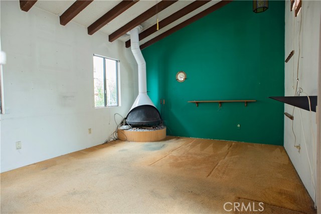 MASTER BEDROOM WITH VINTAGE PREWAY FIREPLACE AND FUNCTIONAL PORT HOLE WINDOW
