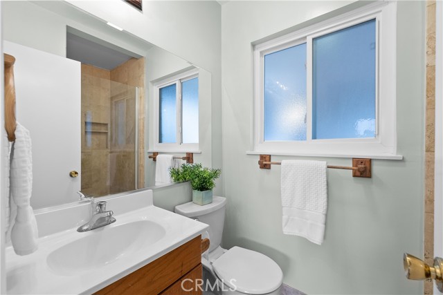 Bathroom 2 (Downstairs Master Bath) with Travertine Shower