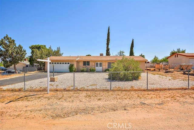 16665 Mesquite Street Hesperia, California Beautiful 3 bedroom 2 bath home! Entry & Large living room with custom interior paint & upgraded laminate flooring, kitchen has updated with white cabinets, newer counter tops & upgraded laminate flooring. Almost half acre fenced lot with large storage shed.