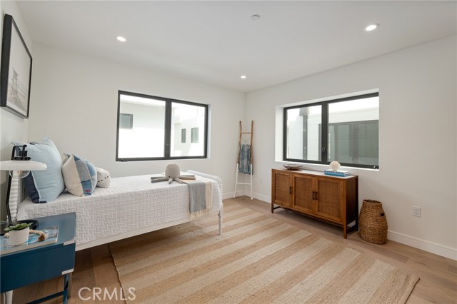 Spacious bedroom wth private bath (shown here using reverse of 961 Unit A staging)