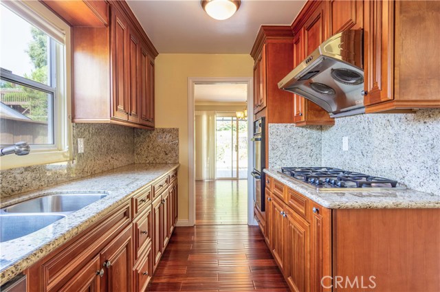 The kitchen has newer granite countertops and stainless steel appliances, some of which have never been used.