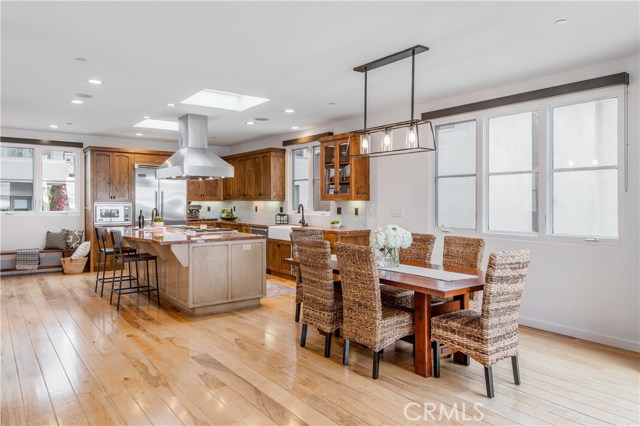 Dining area adjacent to kitchen and living area.Panoramic doors lead to outside decks, but you can enjoy the views while dining, cooking, lounging inside!