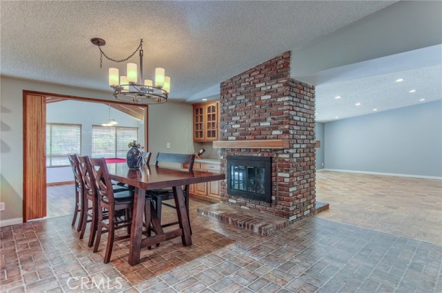 Enjoy goumet meals in this dining room with fireplace and buffet granite counter