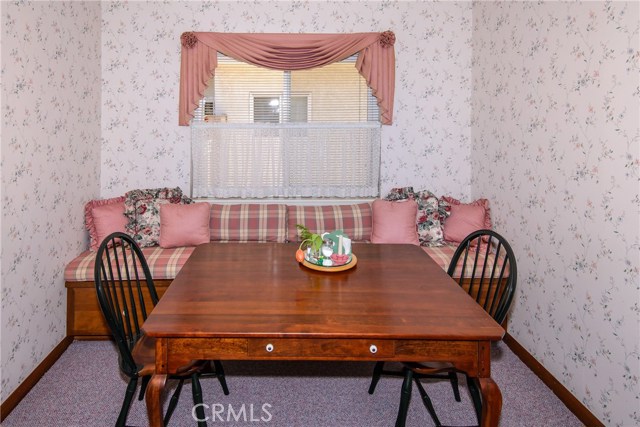 Eat-in kitchen with a built-in bench and additional storage!