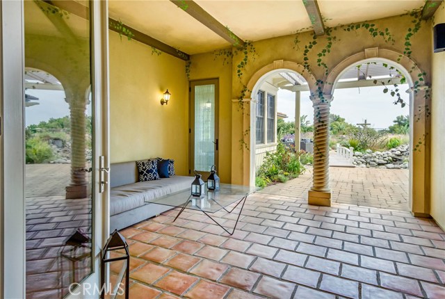 Close to the breakfast nook and kitchen, this is an enclosed patio on your way to the back yard.