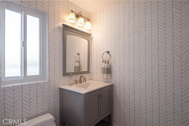 Totally Updated Powder Room with Serena & Lily wallpaper