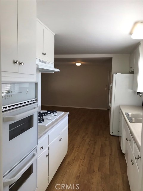 Kitchen looking from entry to dining/living room