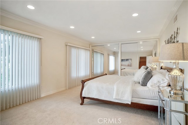 2nd bedroom with large windows looking out to Via Colinita