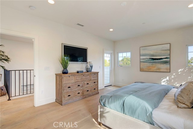 Spacious master bedroom suite with door to hallway and balcony off of the master.