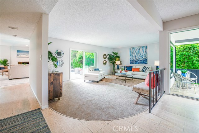Entry with living room, family room and sliders to back patio and yard