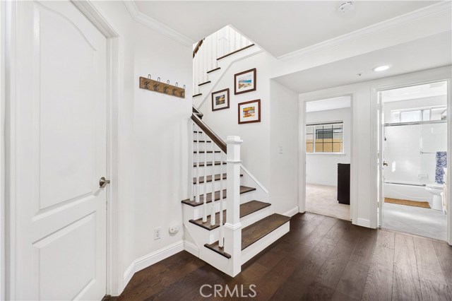 You are greeted by natural light and gleaming hardwoods