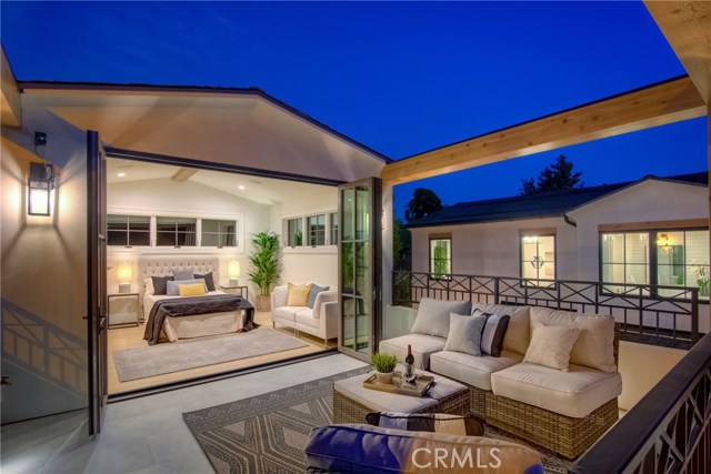 Private guest/in-law suite above the 3 car garage with outdoor sitting/patio area.  LaCantina door systems for the perfect indoor/outdoor experience.