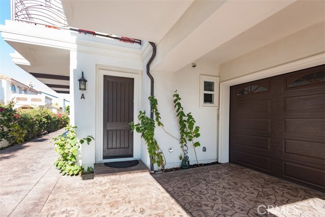 Oversized wood entry door, stamped concrete and extra parking