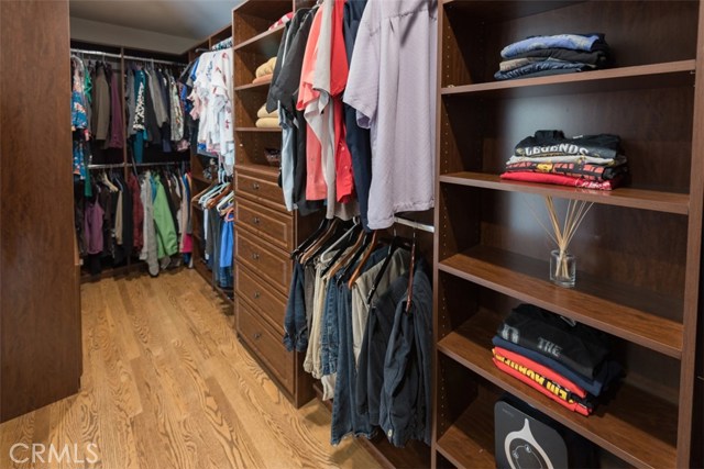 Extra large custom designed Master Closet for his/hers combined.