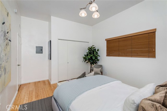 One of two bedrooms downstairs. Nice size closet, high ceilings, bamboo floors.. serene space.