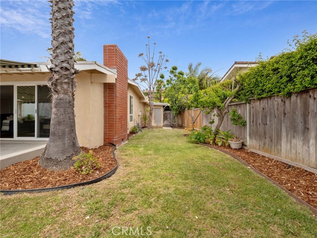 Side yard looking toward front; also access to garage