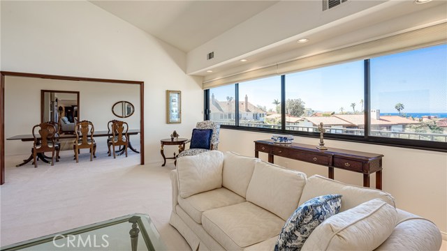 Living room (pre-staging) with views and high ceilings