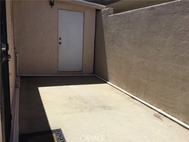 Front house side patio and storage unit