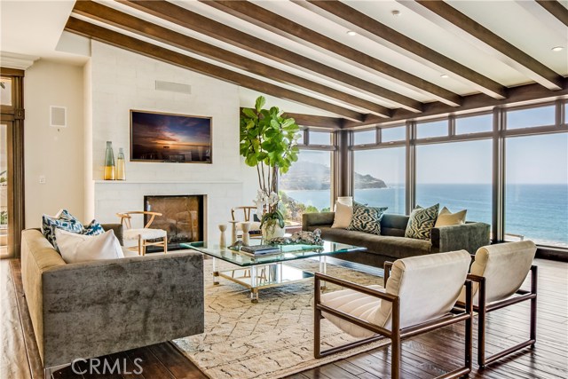 Stunning living room with fireplace and spectacular views.