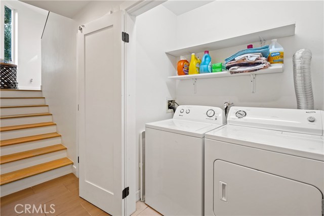 Laundry area and closet under the stairs