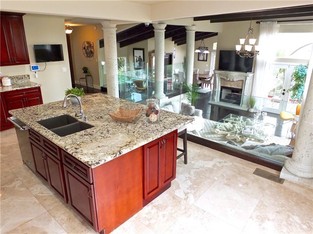 The gourmet kitchen overlooks the living and dining areas