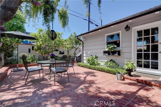 Private garden area is brimming with flowers!  Ideal for entertaining and plenty of room for social distancing!