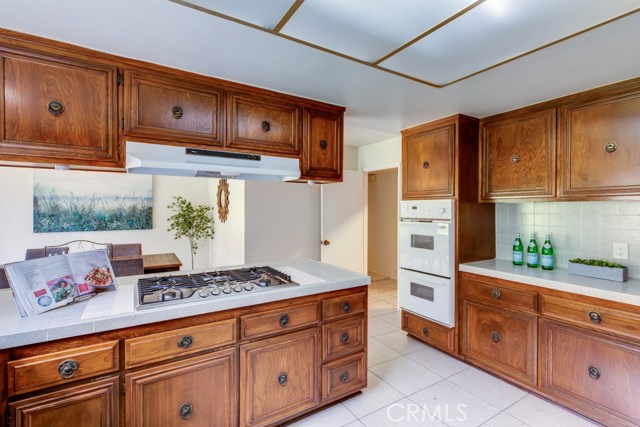 Wood cabinetry and lots of counter space surround the spacious chef's kitchen