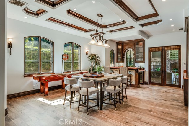 Billiards room currently staged as game room located on main floor