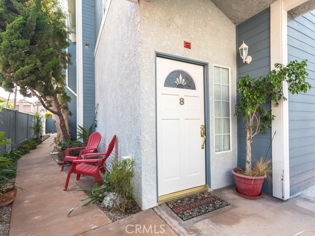 Sweet side yard leads you to the front door of the unit.