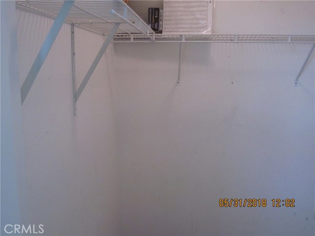 Very large walk-in closet and storage in loft.