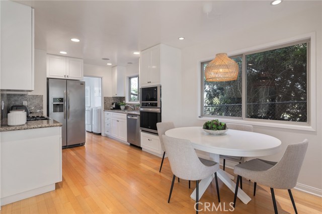 Remodeled main kitchen with dining area and stainless steel appliances (including brand new oven).