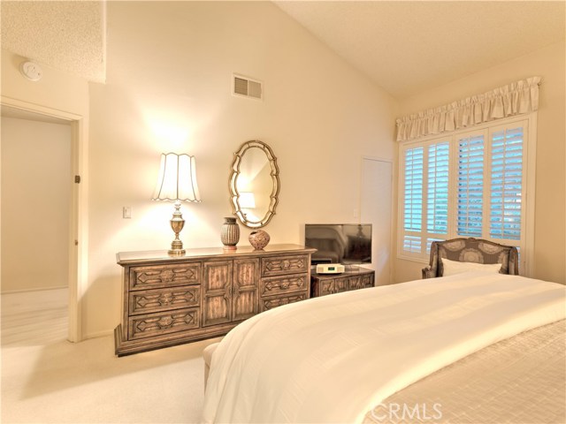 Master bedroom with custom shudders and extra storage space