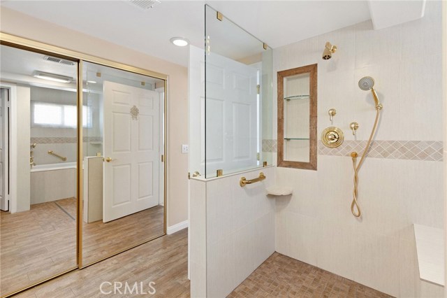 custom bathroom shower with a separate soaking tub... this has a French drain has wheel chair access